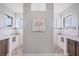 Luxurious primary bathroom with dual sinks, marble counters, and a walk-in shower at 10079 Lebanon Dr, Port Charlotte, FL 33981