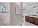 Elegant primary bathroom showcasing dual vanities, marble accents, and a glass-enclosed shower at 10079 Lebanon Dr, Port Charlotte, FL 33981