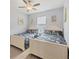 Charming bedroom with two twin beds and nautical-themed decor at 10079 Lebanon Dr, Port Charlotte, FL 33981