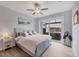 Comfortable bedroom features sliding glass doors to outdoor patio with jacuzzi at 10079 Lebanon Dr, Port Charlotte, FL 33981