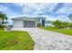 This single-Gathering home has a beautiful paver driveway and attached two-car garage at 10079 Lebanon Dr, Port Charlotte, FL 33981