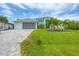 This single-Gathering home has a beautiful paver driveway and attached two-car garage at 10079 Lebanon Dr, Port Charlotte, FL 33981