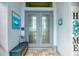 Inviting front entrance features double doors, stylish decor, and a cozy bench at 10079 Lebanon Dr, Port Charlotte, FL 33981