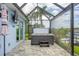 Relax in this screened in lanai with a lovely hot tub and paver flooring at 10079 Lebanon Dr, Port Charlotte, FL 33981