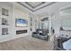 Bright living room with tile flooring, neutral walls, and a decorative stone accent wall with a fireplace at 10079 Lebanon Dr, Port Charlotte, FL 33981