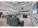 Spacious living room boasts an open floor plan, tile floors, and a sliding door leading to a patio at 10079 Lebanon Dr, Port Charlotte, FL 33981