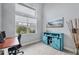 Bright office space with a large window and custom cabinet at 10079 Lebanon Dr, Port Charlotte, FL 33981
