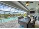Inviting outdoor pool area with ample seating and waterfront views at 10079 Lebanon Dr, Port Charlotte, FL 33981