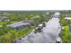 Gorgeous waterfront views from the backyard which boasts a screened pool and boat dock at 10079 Lebanon Dr, Port Charlotte, FL 33981