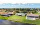 Expansive backyard with a screened-in lanai, offering a peaceful waterfront view and ample space for outdoor activities at 104 Mark Twain Ln, Rotonda West, FL 33947