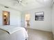 Bedroom with en-suite bathroom and a view of the kitchen through an open doorway at 104 Mark Twain Ln, Rotonda West, FL 33947