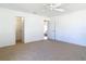 Carpeted bedroom with closet and access to rooms provides comfortable living at 104 Mark Twain Ln, Rotonda West, FL 33947
