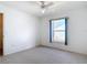 Carpeted bedroom with window providing natural light and comfortable living space at 104 Mark Twain Ln, Rotonda West, FL 33947