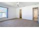 Carpeted bedroom with walk-in closet and window offering a comfortable living space at 104 Mark Twain Ln, Rotonda West, FL 33947