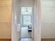 Walk-in closet leads to bedroom with window view at 104 Mark Twain Ln, Rotonda West, FL 33947