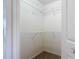A walk-in closet with carpet flooring and multiple wire shelving units for optimal storage and organization at 104 Mark Twain Ln, Rotonda West, FL 33947