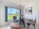 Eat in dining area with large window, modern table and seating, and natural light at 104 Mark Twain Ln, Rotonda West, FL 33947
