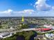 An aerial view showing the waterfront home near canals, bridges, and the city at 1060 Haste Ln, Englewood, FL 34223