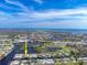 Beautiful aerial view of waterfront homes on canals with city and ocean views at 1060 Haste Ln, Englewood, FL 34223