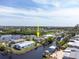An aerial view of a waterfront property with a boat dock and beautiful canal views at 1060 Haste Ln, Englewood, FL 34223