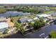 Aerial view of a waterfront home with a private dock, lush landscaping, and inviting outdoor spaces outlined in yellow at 1060 Haste Ln, Englewood, FL 34223