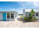 The backyard offers a waterfront view and features a shed and covered patio, perfect for relaxing outdoors at 1060 Haste Ln, Englewood, FL 34223