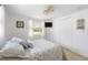 Bright bedroom with a large closet, soft window treatments, and a comfortable bed offering a relaxing retreat at 1060 Haste Ln, Englewood, FL 34223