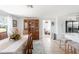 Open-concept dining room adjacent to a well-lit kitchen and an additional living area with comfortable seating and modern appliances at 1060 Haste Ln, Englewood, FL 34223
