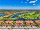 Beautiful aerial view showcasing the property's location, with a lake and golf course at 10788 Tarflower Dr # 201, Venice, FL 34293