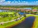 Beautiful aerial shot of the golf course, houses, and landscaping in this community on a sunny day at 10788 Tarflower Dr # 201, Venice, FL 34293