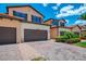 Beautifully maintained two-story villa with a paver driveway and lush landscaping enhancing curb appeal at 10788 Tarflower Dr # 201, Venice, FL 34293