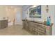 Tastefully decorated foyer featuring carved wood furniture, tile flooring, and a staircase at 10788 Tarflower Dr # 201, Venice, FL 34293