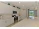 Bright and modern kitchen with stainless appliances, ample counter space, and view at 10788 Tarflower Dr # 201, Venice, FL 34293