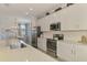 Island seating is a feature of this spacious kitchen at 10788 Tarflower Dr # 201, Venice, FL 34293