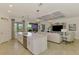 View of the kitchen island, living room and outdoor space at 10788 Tarflower Dr # 201, Venice, FL 34293