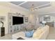 Bright living room boasts a custom entertainment center and views into other areas at 10788 Tarflower Dr # 201, Venice, FL 34293