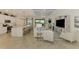 Bright and open living space with island seating, seamless integration with the living area, and modern decor at 10788 Tarflower Dr # 201, Venice, FL 34293