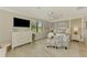 Bright bedroom features a large window overlooking a pond and a patterned accent chair at 10788 Tarflower Dr # 201, Venice, FL 34293