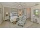 Bedroom featuring a large fan and stylish furniture at 10788 Tarflower Dr # 201, Venice, FL 34293