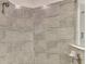 Shower with tiled walls and floor at 10788 Tarflower Dr # 201, Venice, FL 34293