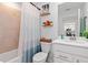Cozy bathroom featuring a shower-tub combo and storage at 12470 Wellen Golf St # 107, Venice, FL 34293