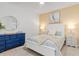 Cozy bedroom with modern decor, plush bedding, and ample natural light at 12470 Wellen Golf St # 107, Venice, FL 34293