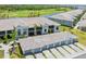 The building offers a refined facade, and screened-in lanais overlooking mature palm trees and vibrant green lawns at 12470 Wellen Golf St # 107, Venice, FL 34293