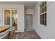 View of the patio showcasing tile flooring, outdoor seating and a glimpse of the kitchen at 12470 Wellen Golf St # 107, Venice, FL 34293