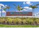Wellen Park Golf & Country Club community entrance sign with bright blue lettering, plants, and palm trees at 12470 Wellen Golf St # 107, Venice, FL 34293
