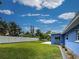 Picture of expansive green backyard with a newer, white fence at 1295 S Maryknoll Rd, Englewood, FL 34223