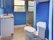 Bathroom featuring a modern vanity, toilet, and glass enclosed shower with decorative tile at 1295 S Maryknoll Rd, Englewood, FL 34223