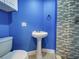 Bathroom featuring a modern vanity, toilet, and glass enclosed shower with decorative tile at 1295 S Maryknoll Rd, Englewood, FL 34223
