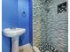 Bathroom featuring a modern vanity, toilet, and glass enclosed shower with decorative tile at 1295 S Maryknoll Rd, Englewood, FL 34223