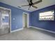 Bedroom featuring natural light from the window, an open closet, and view to other rooms at 1295 S Maryknoll Rd, Englewood, FL 34223